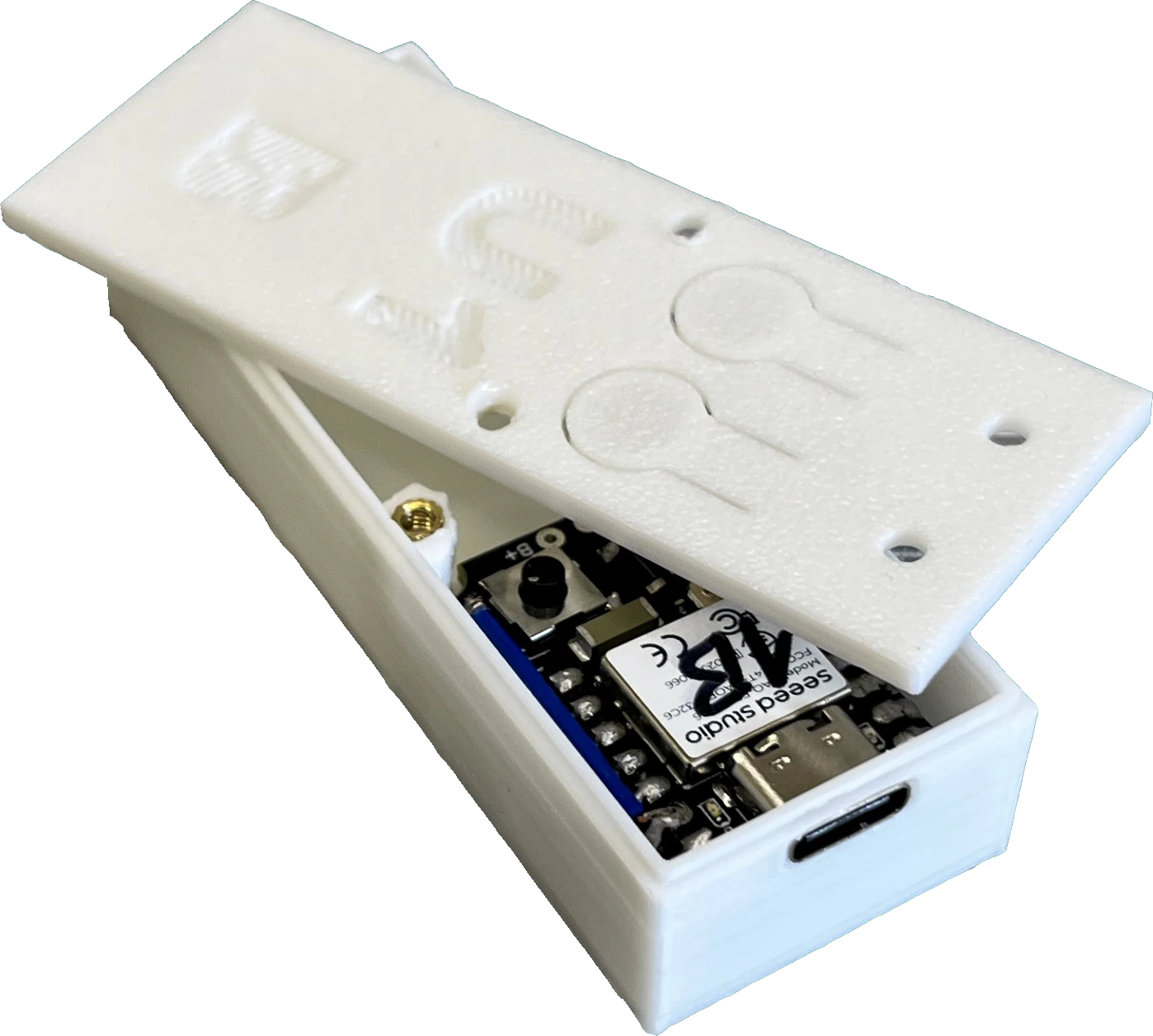 Anti-theft alarm device opened up, showing the 3D-printed housing and the electronics inside