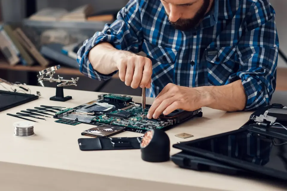 Engineer reviewing an electronic prototype